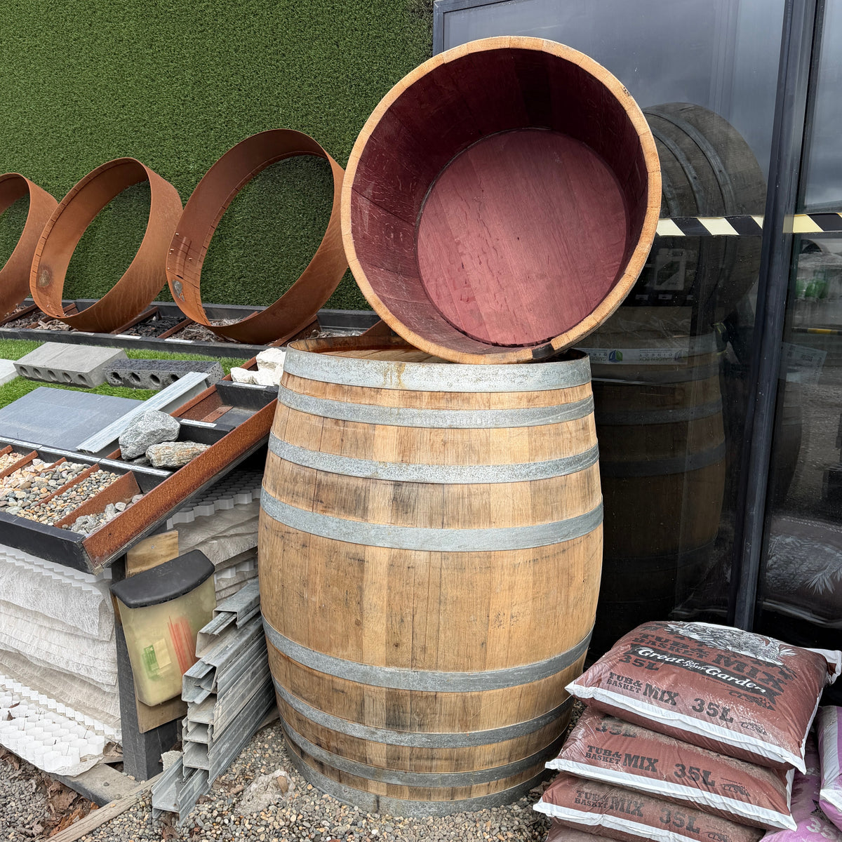 Wine Barrel 500 ltr with a half wine barrel on top