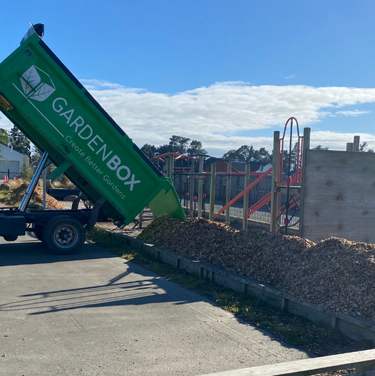 Garden Box Truck delivering Playground Chip to Playground
