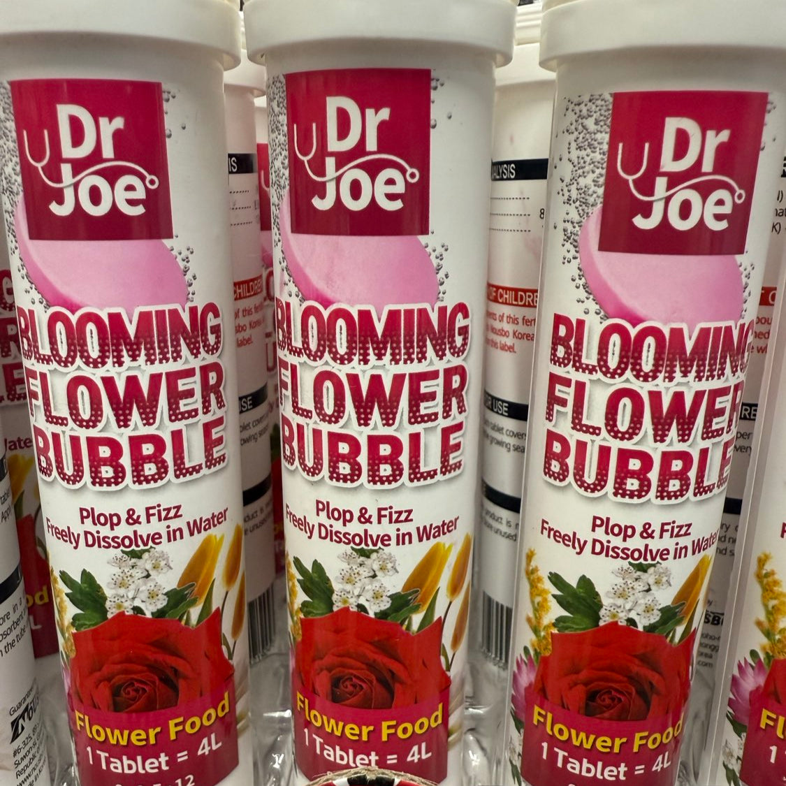 Multiple bottles of Dr. Joe Blooming Flower Bubble flower food.