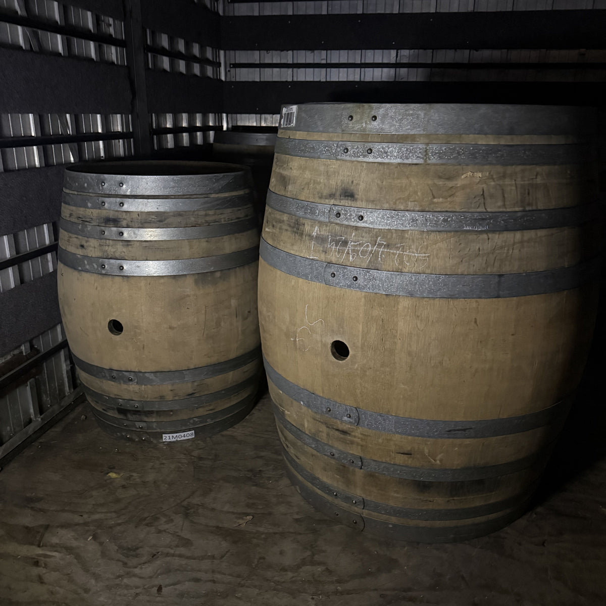 Wine Barrels 220 and 500 ltr in a truck
